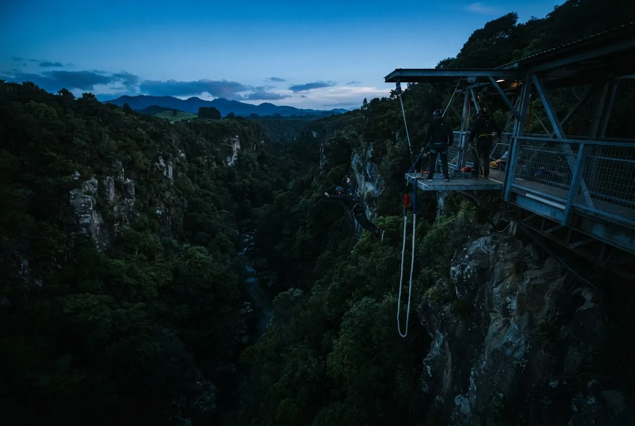 Dramatic aerial view of bungee jumping platform over rugged New Zealand canyon